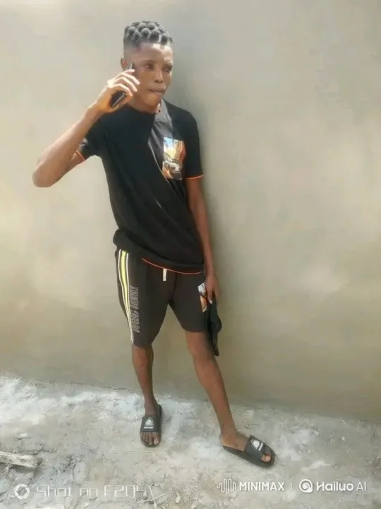 Young Man on Phone in Casual Attire – AI Generated Video | Hailuo AI