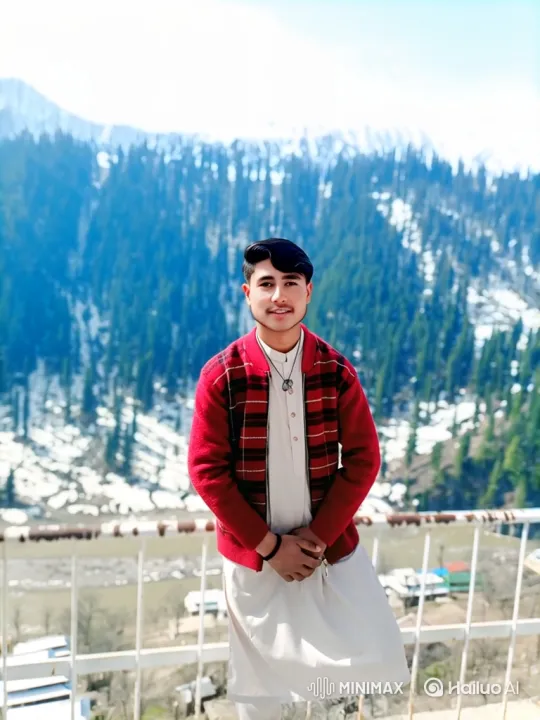 Young Man Smiles on Mountain Balcony – AI Generated Video | Hailuo AI