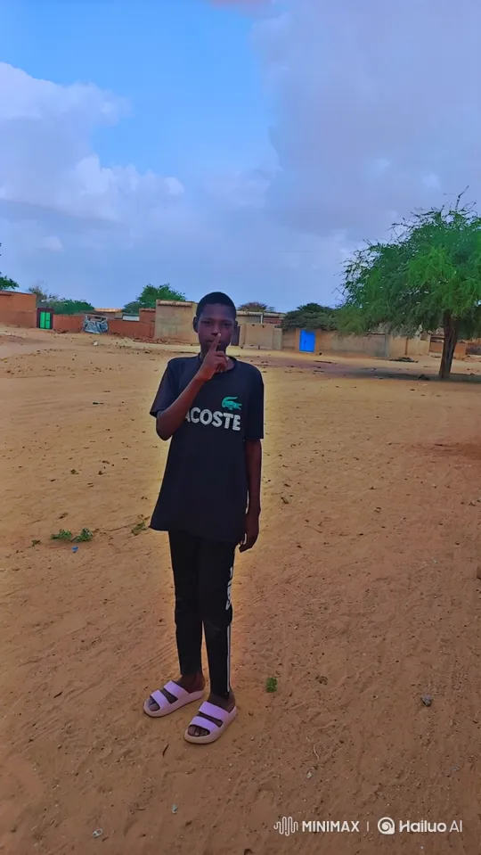 Young Person Gestures 'Shh' in Sandy Landscape Video – AI Generated Video | Hailuo AI