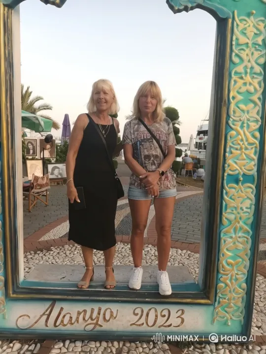 Alanya 2023: Two Friends Pose in Picture Frame – AI Generated Video | Hailuo AI