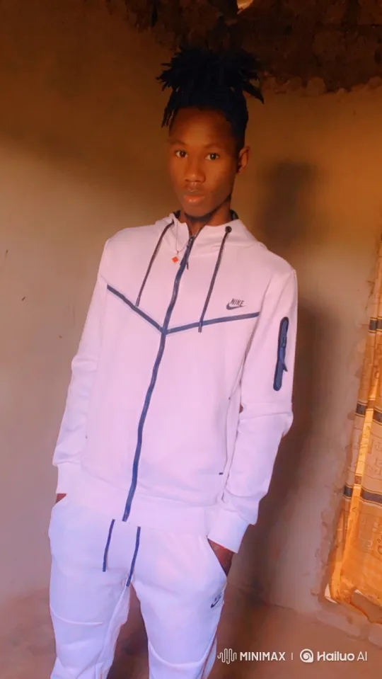 Young Man in White Tracksuit Stands Calmly – AI Generated Video | Hailuo AI