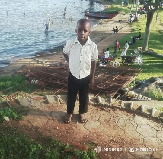 Young Boy Observes Waterfront in Calm Stance – AI Generated Video | Hailuo AI