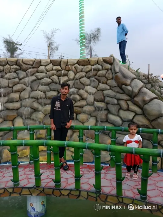 Young Man on Bridge Amidst Park's Gentle Movements – AI Generated Video | Hailuo AI