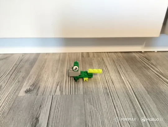 LEGO Creature Hops Across Wood-Floor Landscape – AI Generated Video | Hailuo AI