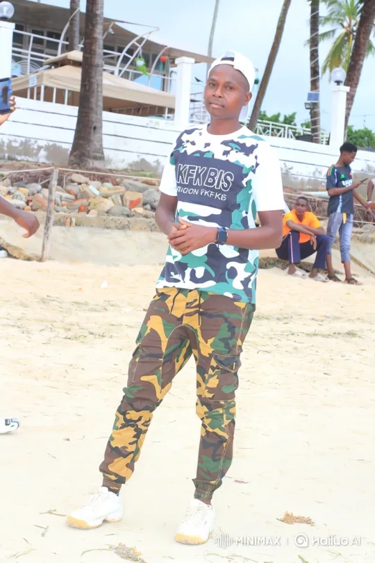 Young Man in Camouflage Approaches Camera with Confidence – AI Generated Video | Hailuo AI