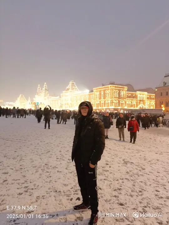 Winter Evening in Snow-Covered Square with Illuminated Building – AI Generated Video | Hailuo AI