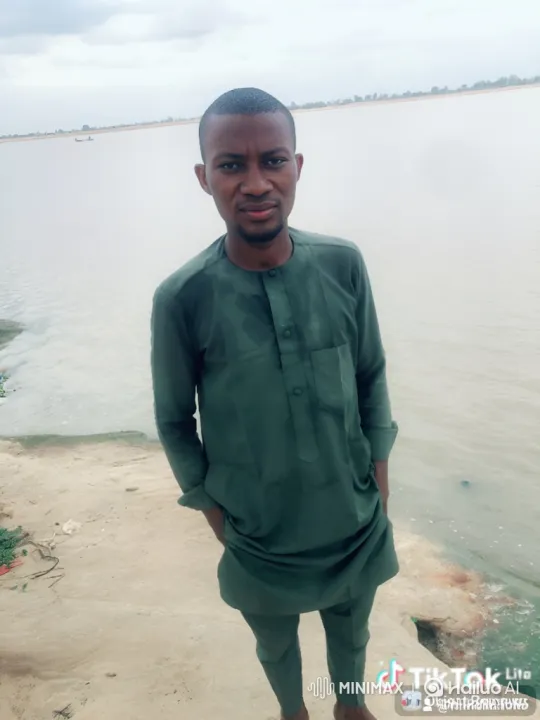 Young Man Enters Car on Sandy Riverbank – AI Generated Video | Hailuo AI