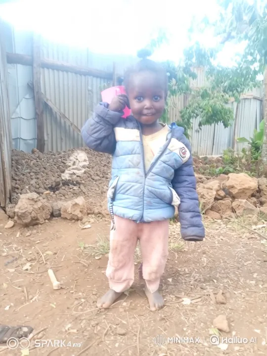 Cheerful Child in Playful Pose with Pink Cup – AI Generated Video | Hailuo AI