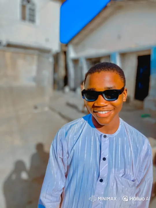 Young Man Smiles, Walks, and Tracks in Sunny Street Scene – AI Generated Video | Hailuo AI