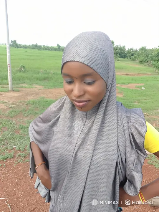 Contemplative Woman in Nature Amidst Gentle Breeze – AI Generated Video | Hailuo AI