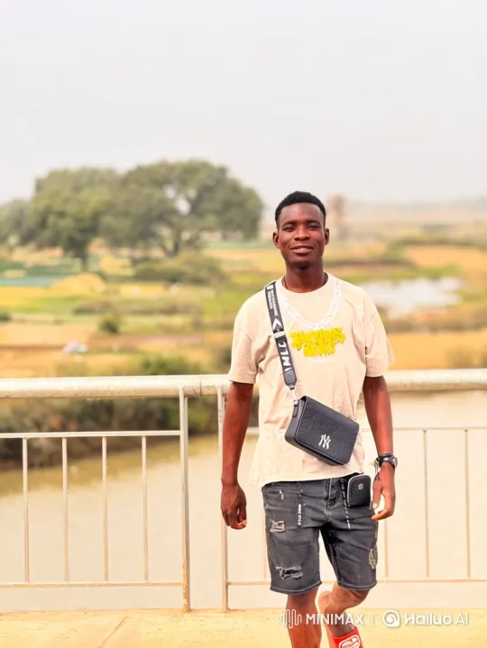 Young Man Walks Towards Camera on Blurred Background – AI Generated Video | Hailuo AI