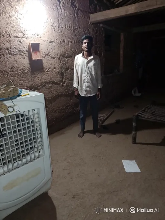 Young Man Adjusts Air Cooler in Dimly Lit Room – AI Generated Video | Hailuo AI
