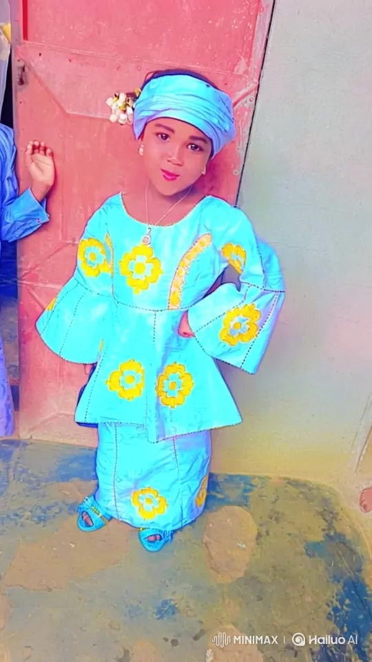 Young Girl Poses Confidently in Floral Embroidered Outfit – AI Generated Video | Hailuo AI