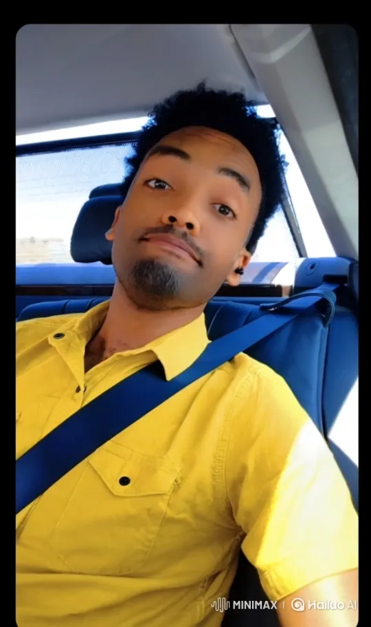Young Man in Yellow Shirt Records Himself in Moving Car – AI Generated Video | Hailuo AI