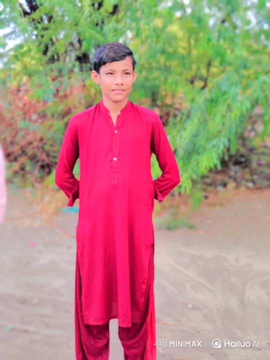 Young Boy in Red Tunic Smiles Warmly at Camera – AI Generated Video | Hailuo AI