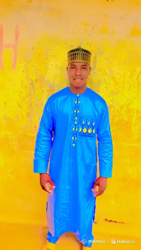 Young Man in Vibrant Blue Tunic Smiles Calmly – AI Generated Video | Hailuo AI