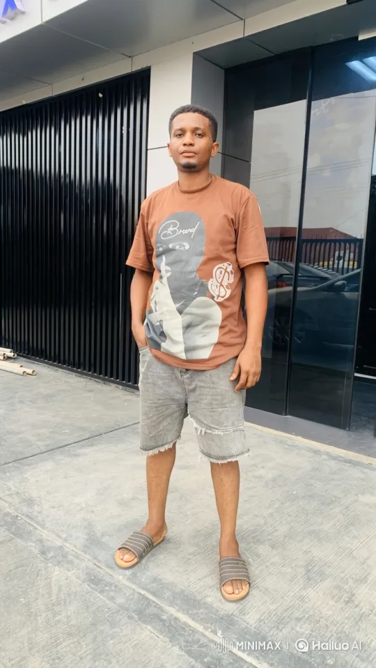 Serene Portrait of a Young Man in Urban Setting – AI Generated Video | Hailuo AI