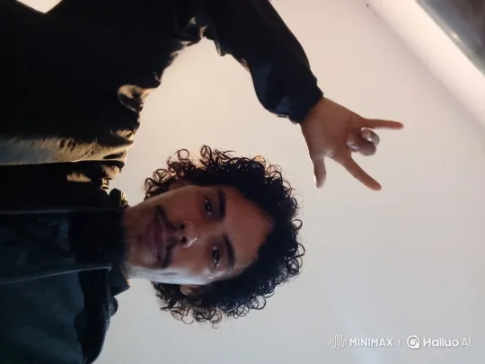 Young Man with Goatee Performs Smooth Camera Tracking Shot – AI Generated Video | Hailuo AI