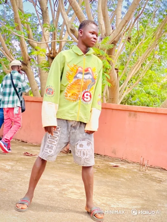 Young Man in Dynamic Pose with Animated Jacket Graphic – AI Generated Video | Hailuo AI