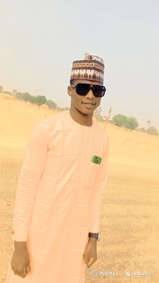 Young Man in Arid Landscape with Gentle Smile – AI Generated Video | Hailuo AI