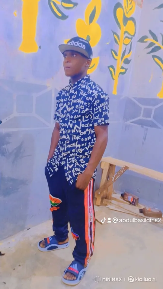 Young Man in Thoughtful Pose in Mural-Wall Setting – AI Generated Video | Hailuo AI
