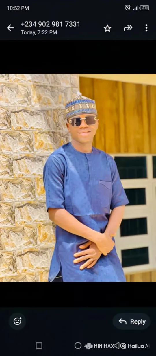 Young Man in Blue Tunic Smiles Gently – AI Generated Video | Hailuo AI