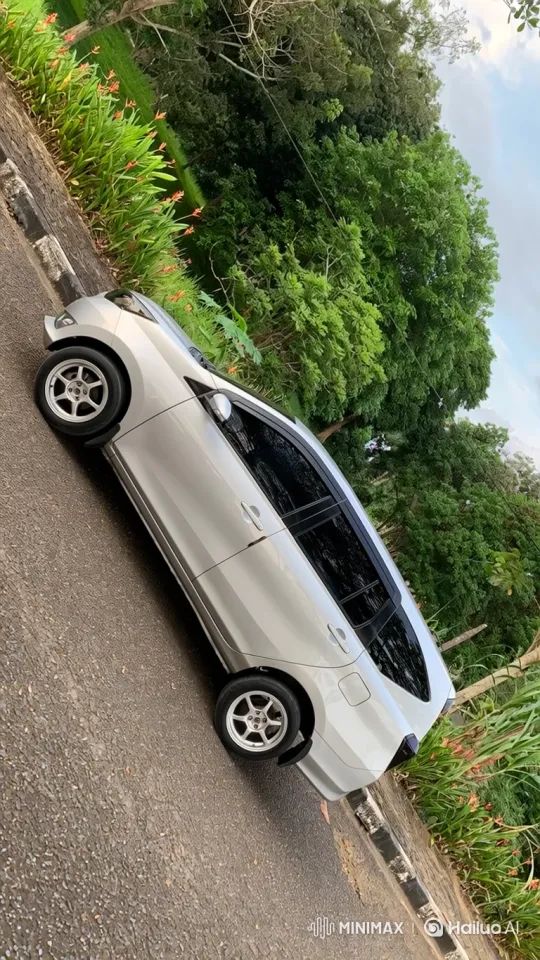 Silver Hatchback Demonstrates Air Suspension System – AI Generated Video | Hailuo AI