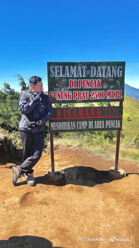 Man Enjoying the View at Mount Prau Summit – AI Generated Video | Hailuo AI