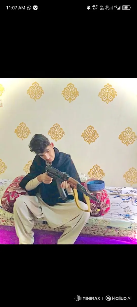 Young Man With Assault Rifle in Introspective Pose – AI Generated Video | Hailuo AI