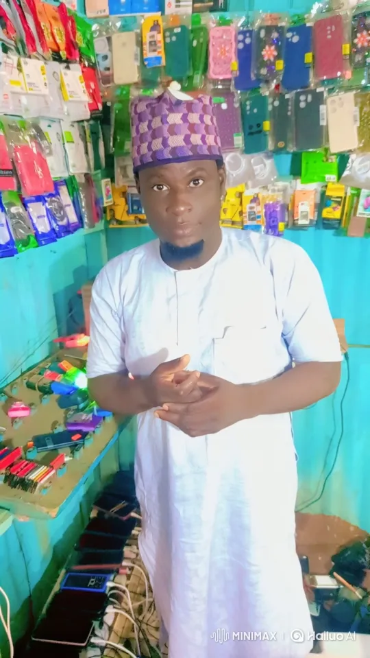 Man in Shop with Accessories, Gradual Smile – AI Generated Video | Hailuo AI
