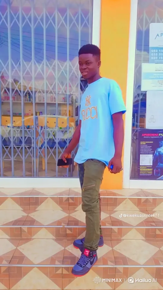 Young Man Descends Stairs with Smartphone – AI Generated Video | Hailuo AI