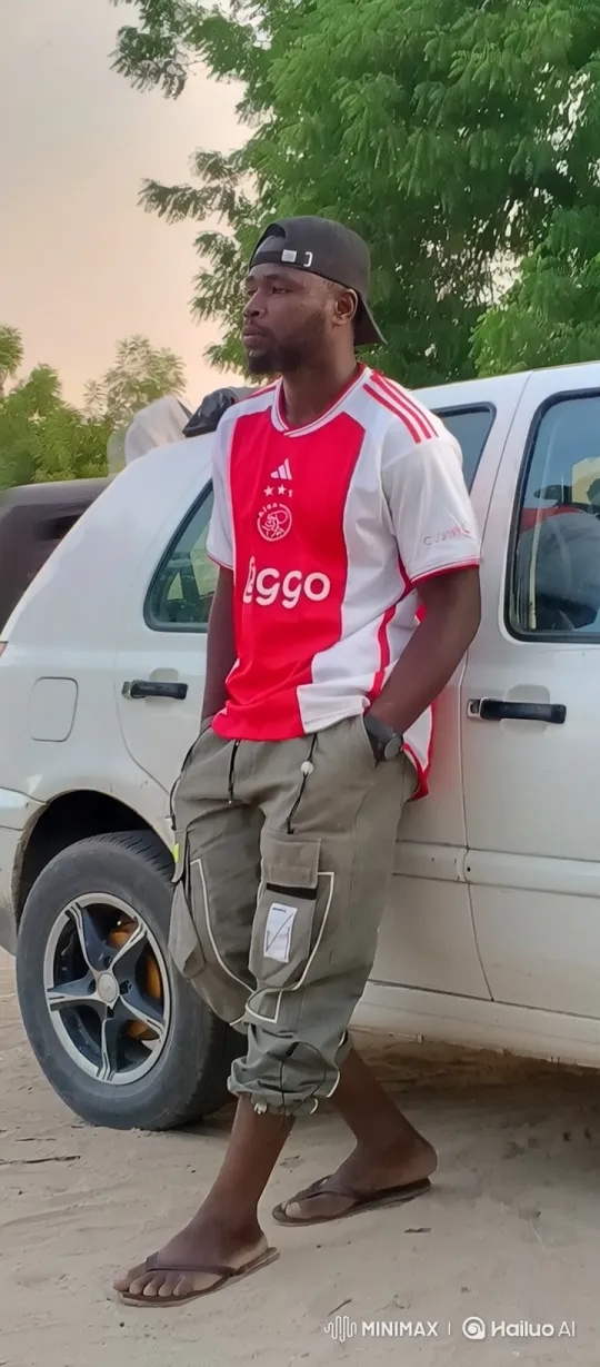 Man in Soccer Jersey Smiles at Camera – AI Generated Video | Hailuo AI