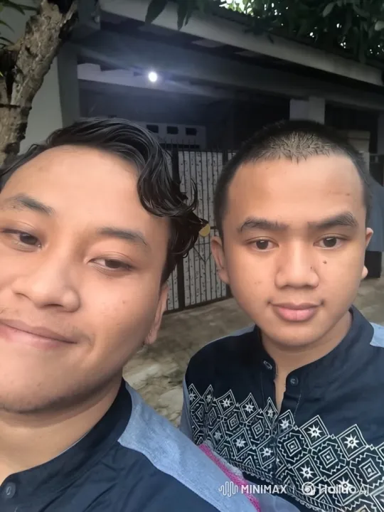 Two Young Men Share a Moment Before a Photo – AI Generated Video | Hailuo AI