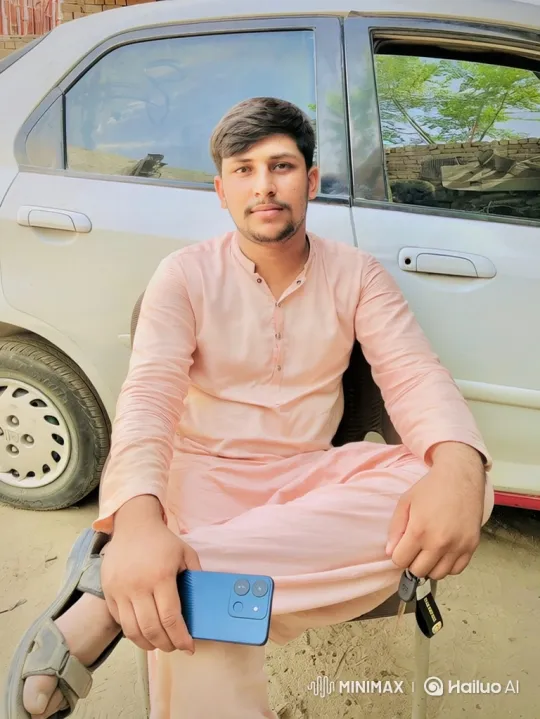 Young Man in Pink Outfit With Smartphone and Keys – AI Generated Video | Hailuo AI