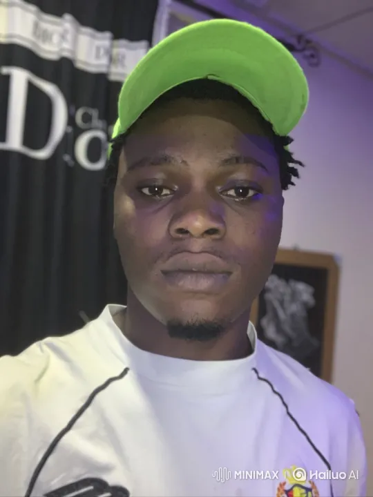 Young Black Man Greets in Soft-Lit Room with Tracking Shot – AI Generated Video | Hailuo AI