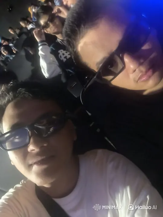 Young Men in 3D Glasses at a Movie Theater – AI Generated Video | Hailuo AI