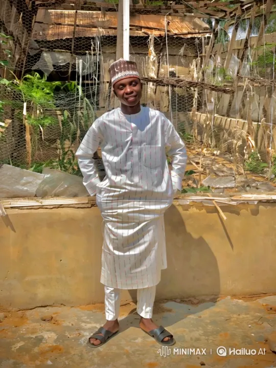Young Man in White Suit Smiles Gently Outdoors – AI Generated Video | Hailuo AI