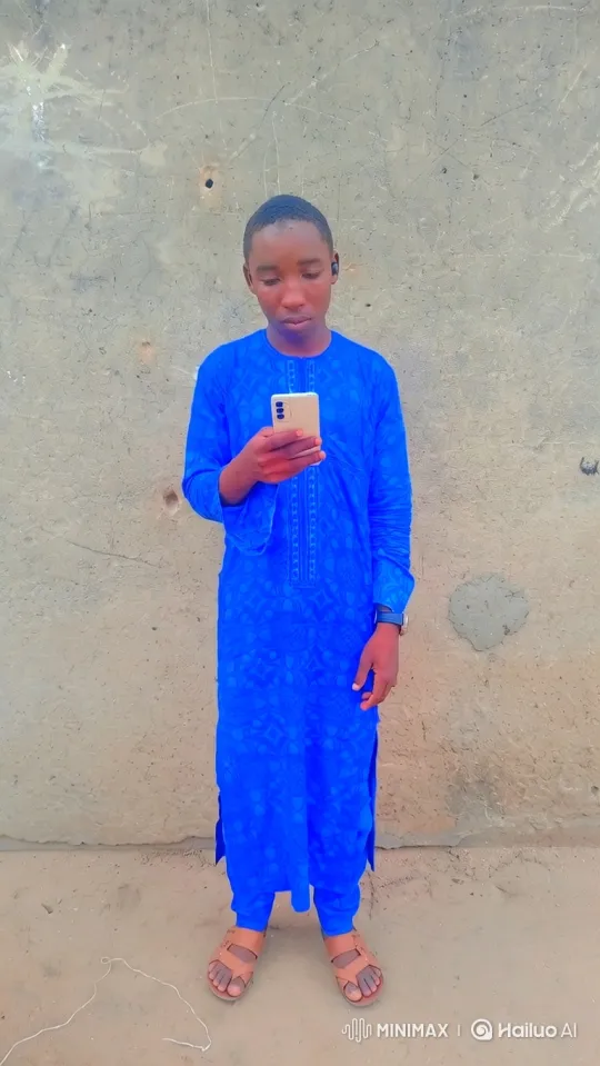 Young Man Engaged with Smartphone by Concrete Wall – AI Generated Video | Hailuo AI