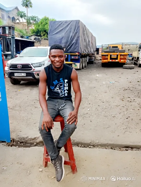 Young Man on Stool Amidst Truck Yard Departure – AI Generated Video | Hailuo AI