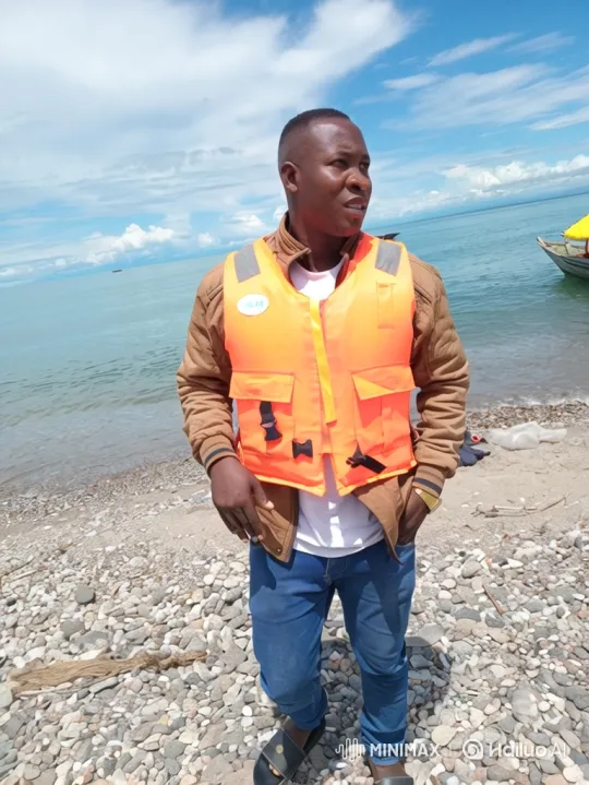 Man in Life Vest Steers Boat on Tranquil Water – AI Generated Video | Hailuo AI