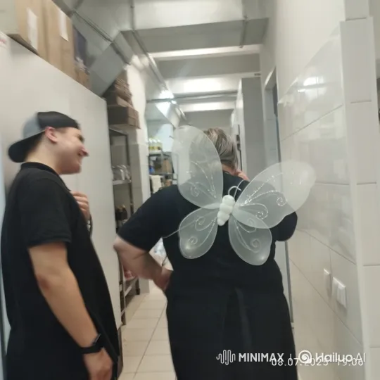 Person in Butterfly Wings Mimics Flight Down Corridor – AI Generated Video | Hailuo AI