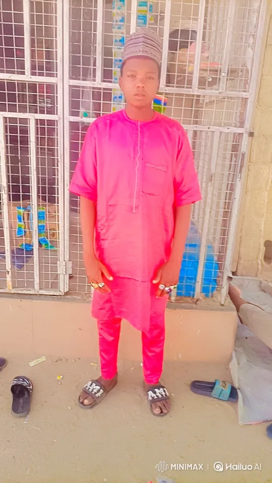 Young Man in Pink Outfit Enters Car by Building – AI Generated Video | Hailuo AI