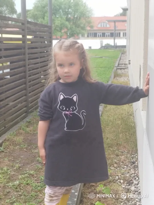 Young Girl Embraces a Black Cat – AI Generated Video | Hailuo AI