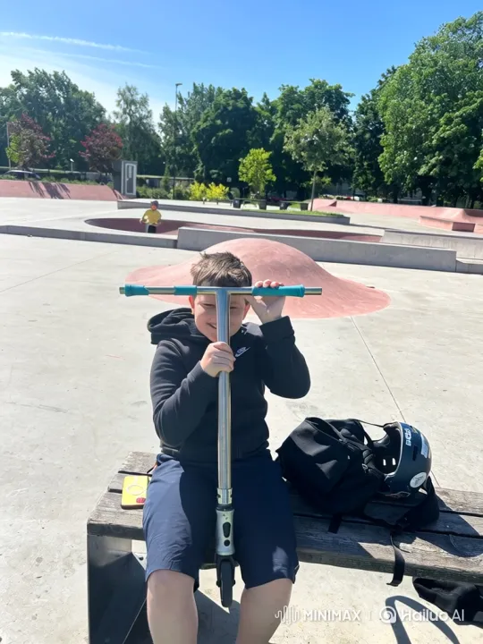 Young Boy Recovers from Fall, Rides Scooter at Skate Park – AI Generated Video | Hailuo AI