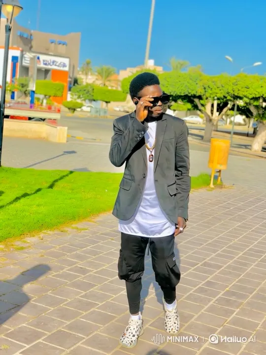 Stylish Young Man Poses Confidently in Sunlit Park – AI Generated Video | Hailuo AI