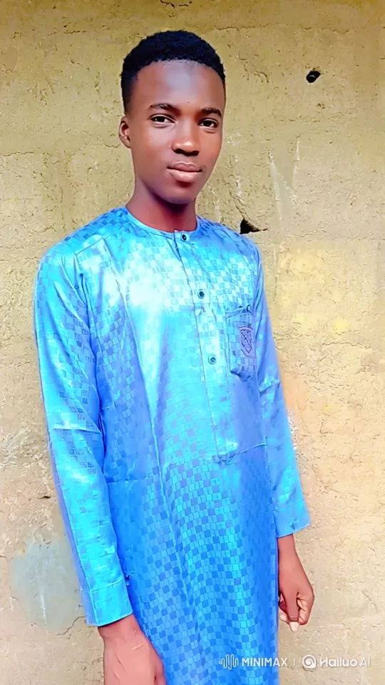 Young Man in Blue Tunic with Camera Movement – AI Generated Video | Hailuo AI