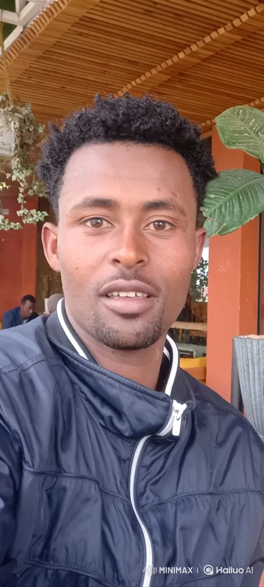 Man with Warm Smile and Gentle Nod in Outdoor Setting – AI Generated Video | Hailuo AI