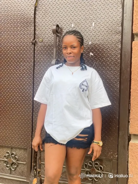 Young Woman in Calm Pose by Metal Door – AI Generated Video | Hailuo AI