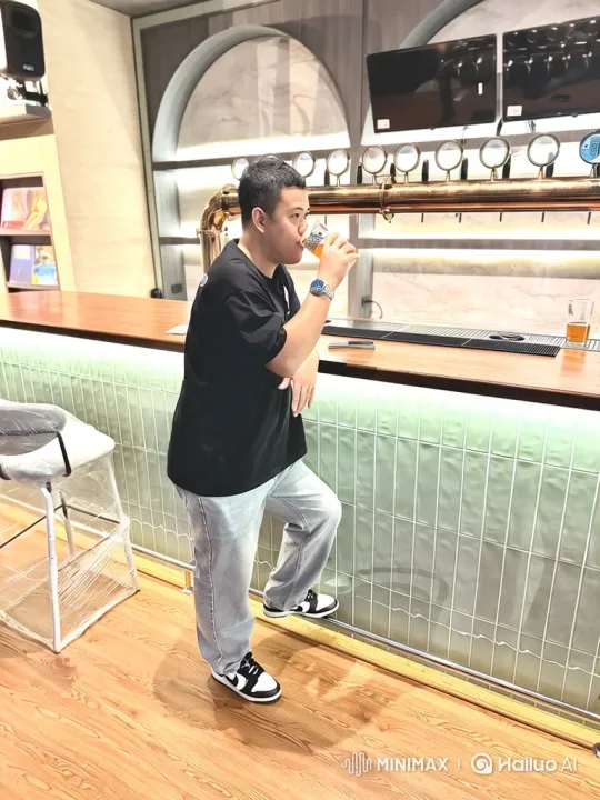Asian Man Enjoying Beer at Modern Bar – AI Generated Video | Hailuo AI