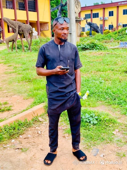 Man in Black Outfit Observes Scenery with Phone – AI Generated Video | Hailuo AI